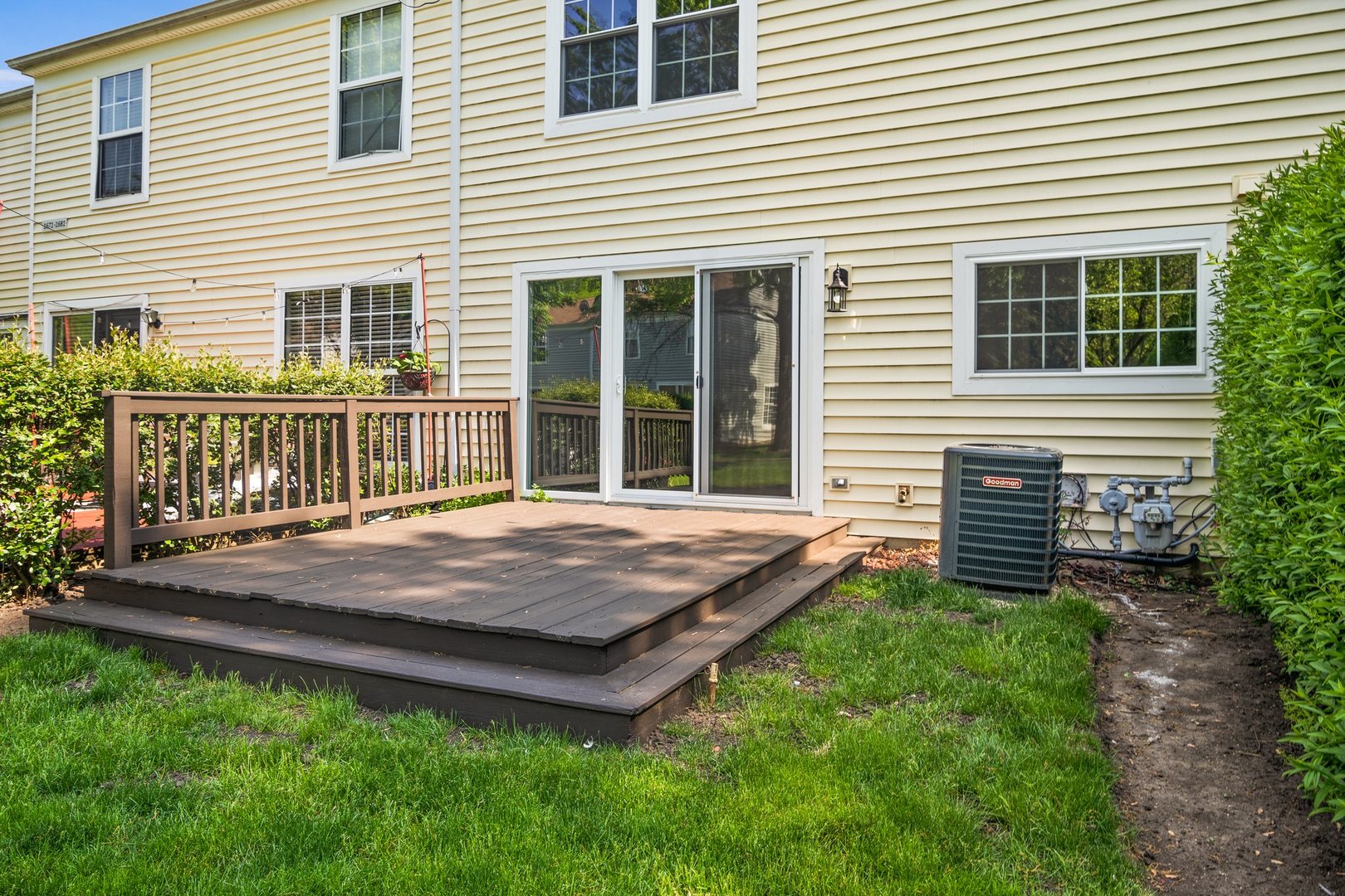 1673 Pebble Beach Circle Elgin, IL 60123 - Photo 23 of 25 a view of a house with a backyard and wooden fence