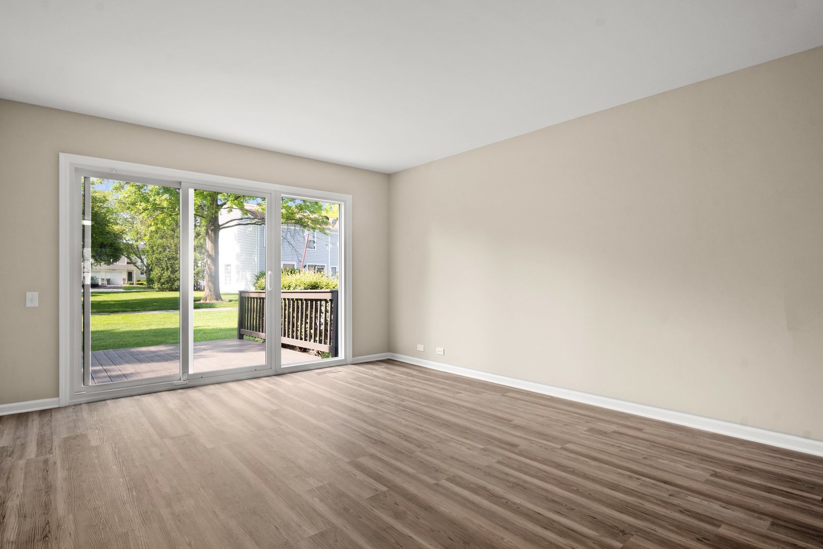 1673 Pebble Beach Circle Elgin, IL 60123 - Photo 4 of 25 a view of an empty room with a fireplace and a window