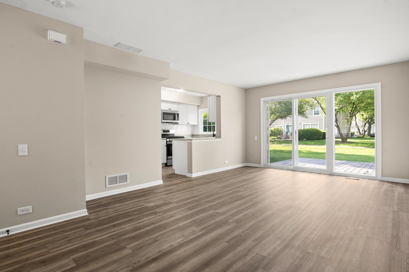 1673 Pebble Beach Circle Elgin, IL 60123 - Photo 5 of 25 a view of empty room with wooden floor and fan