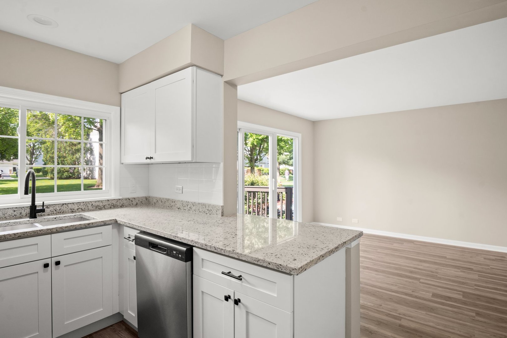 1673 Pebble Beach Circle Elgin, IL 60123 - Photo 10 of 25 a kitchen with a sink cabinets and window