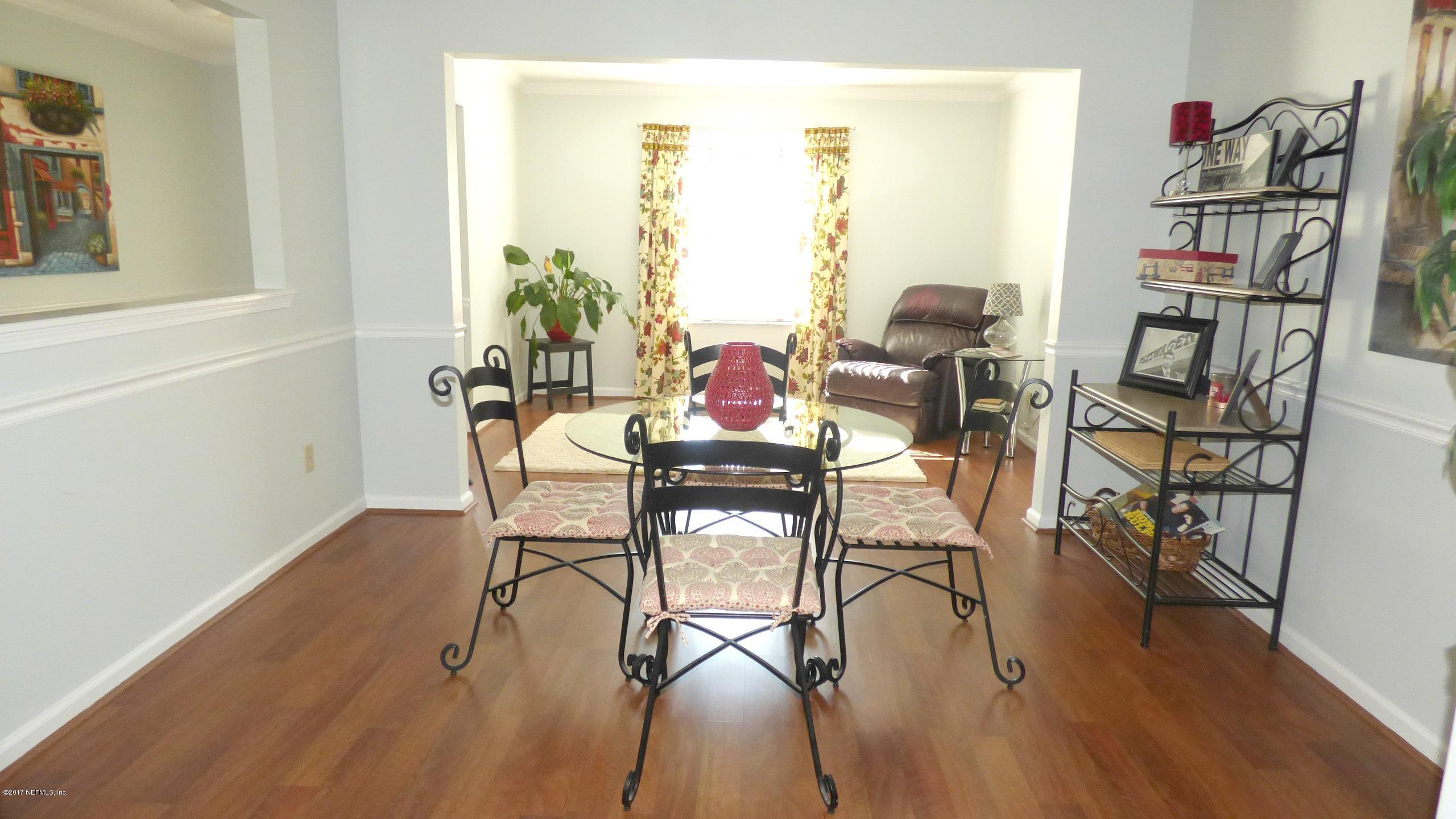 1218 Raleigh Ridge Drive Jacksonville, FL 32225 - Photo 13 of 14 a dining room with furniture and wooden floor