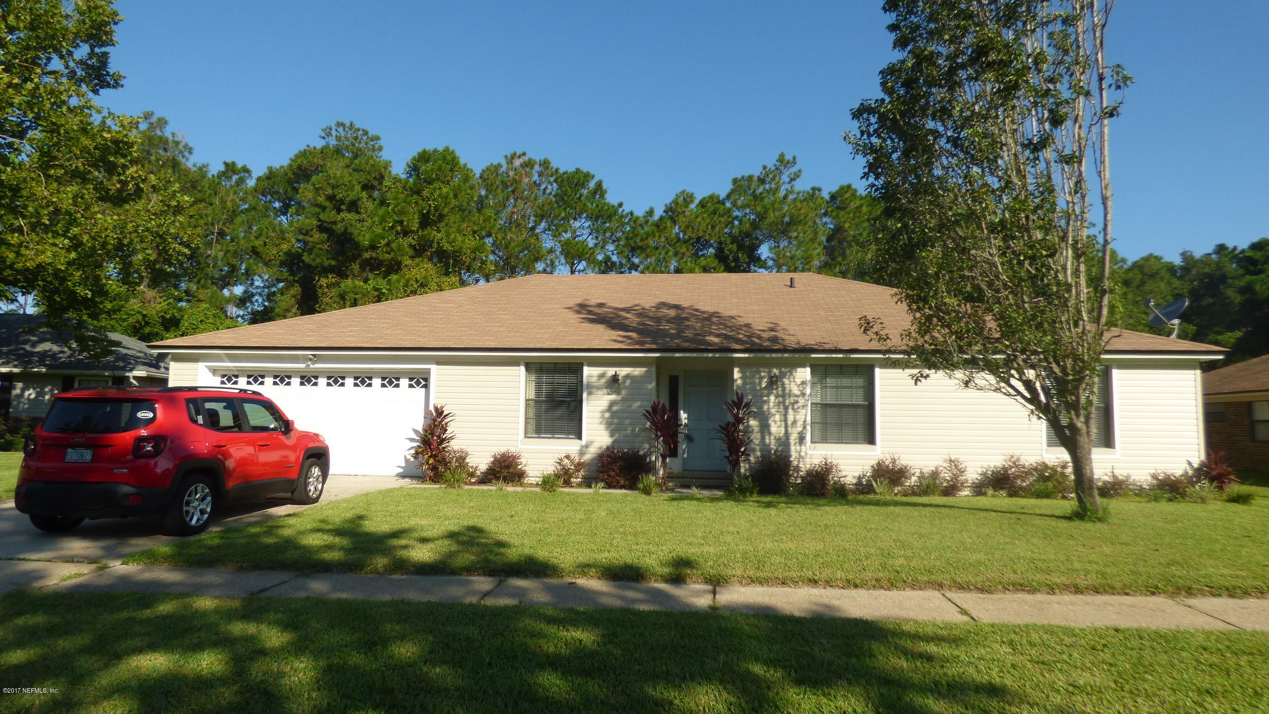 1218 Raleigh Ridge Drive Jacksonville, FL 32225 - Photo 14 of 14 a view of a house with a yard