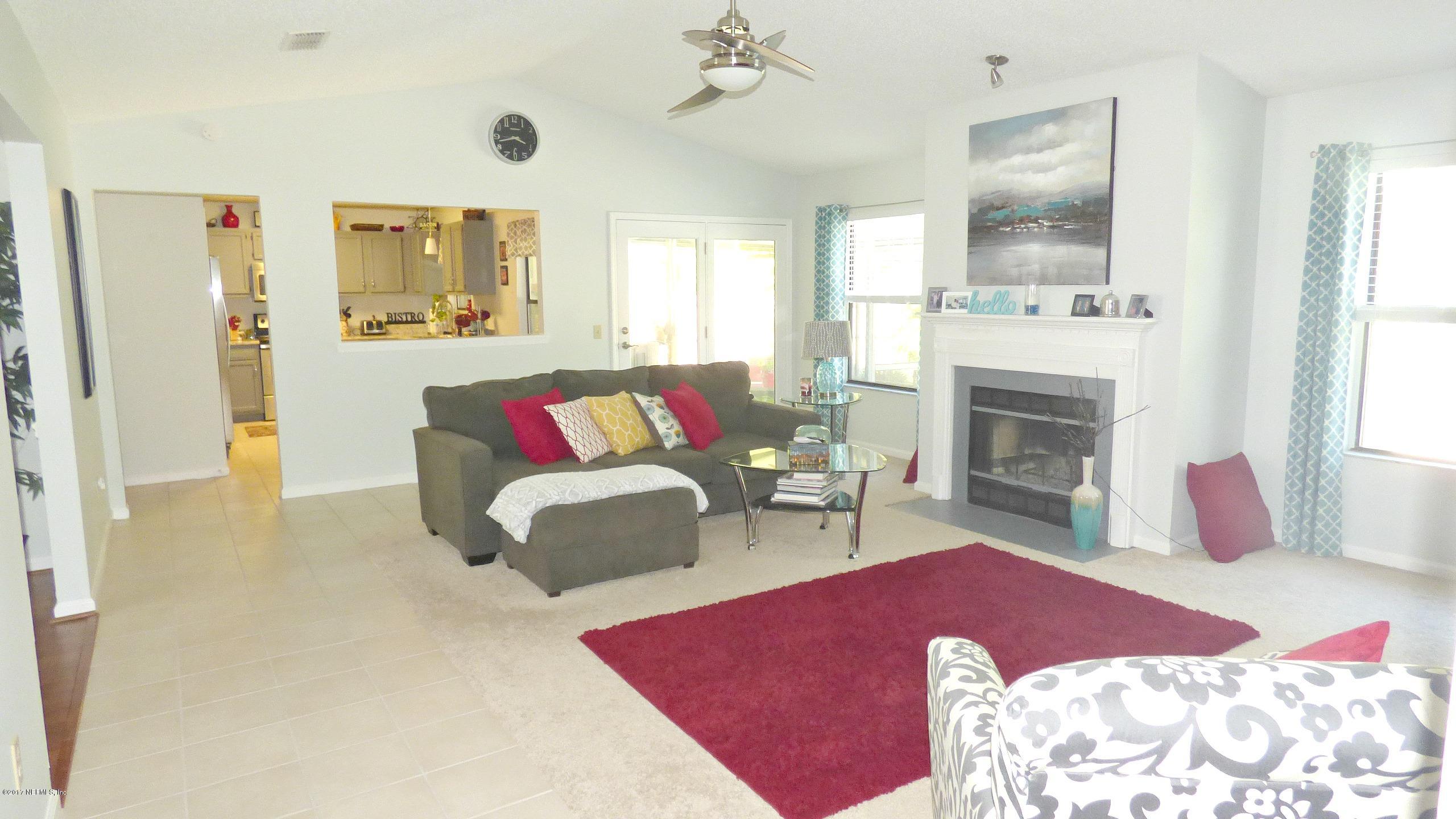 1218 Raleigh Ridge Drive Jacksonville, FL 32225 - Photo 5 of 14 a living room with furniture and a fireplace