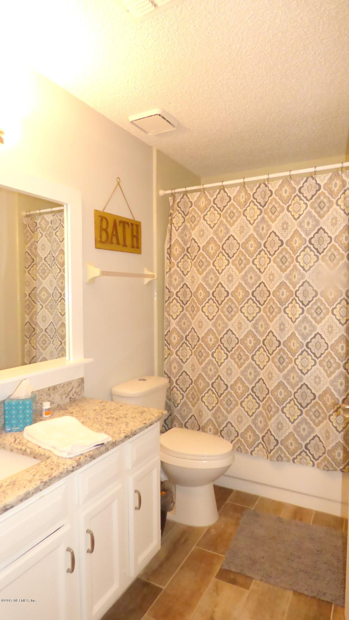 1218 Raleigh Ridge Drive Jacksonville, FL 32225 - Photo 7 of 14 a bathroom with a granite countertop sink toilet and shower
