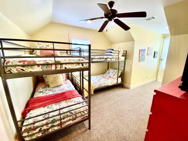 a bedroom with furniture and window