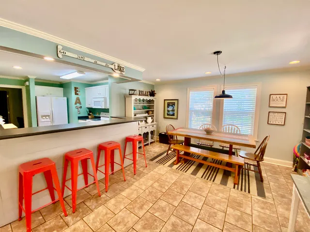 a living room with furniture a table and chairs