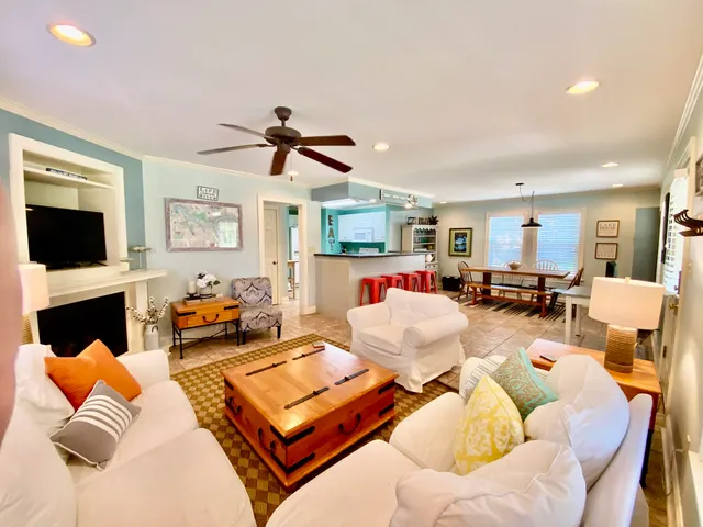 a living room with furniture fireplace and a flat screen tv
