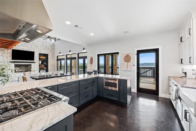 a bathroom with a double vanity sink mirror and shower