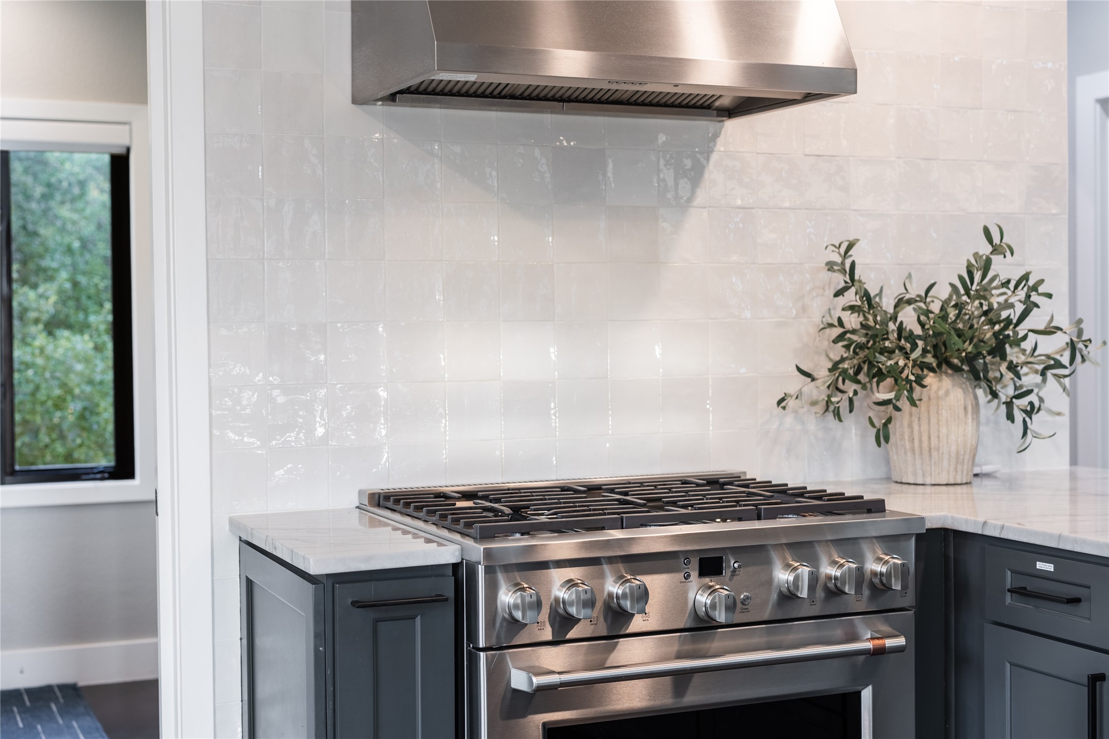 516 Deckhouse Drive Point Venture, TX 78645 - Photo 12 of 36 a stove top oven sitting inside of a kitchen