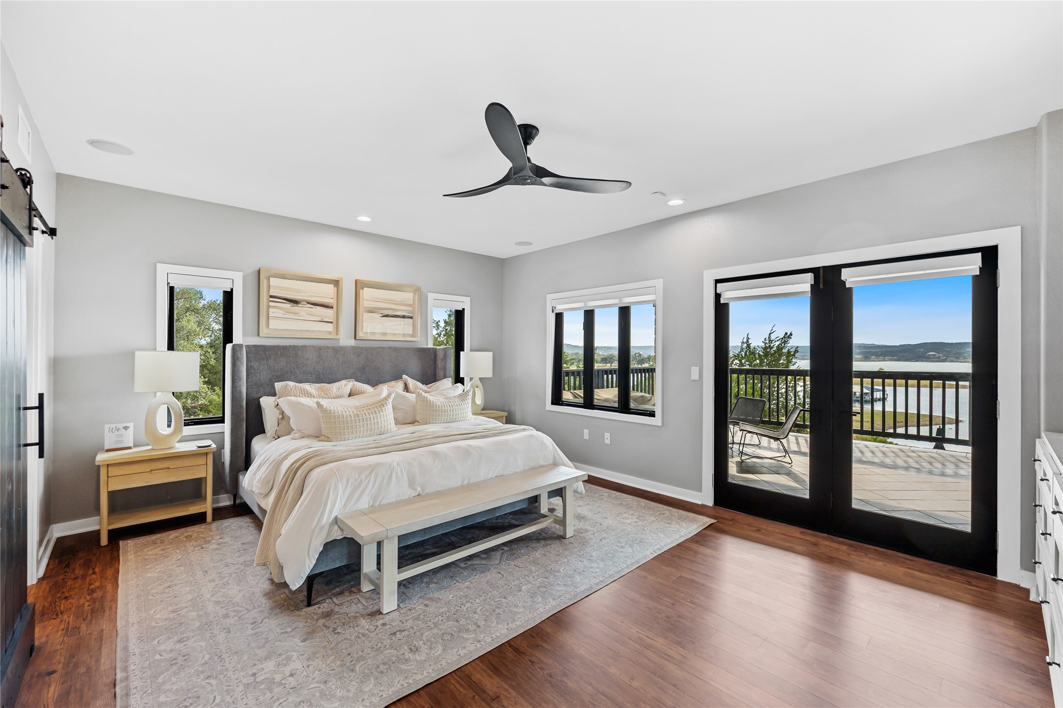 516 Deckhouse Drive Point Venture, TX 78645 - Photo 13 of 36 a bedroom with a large bed and a window