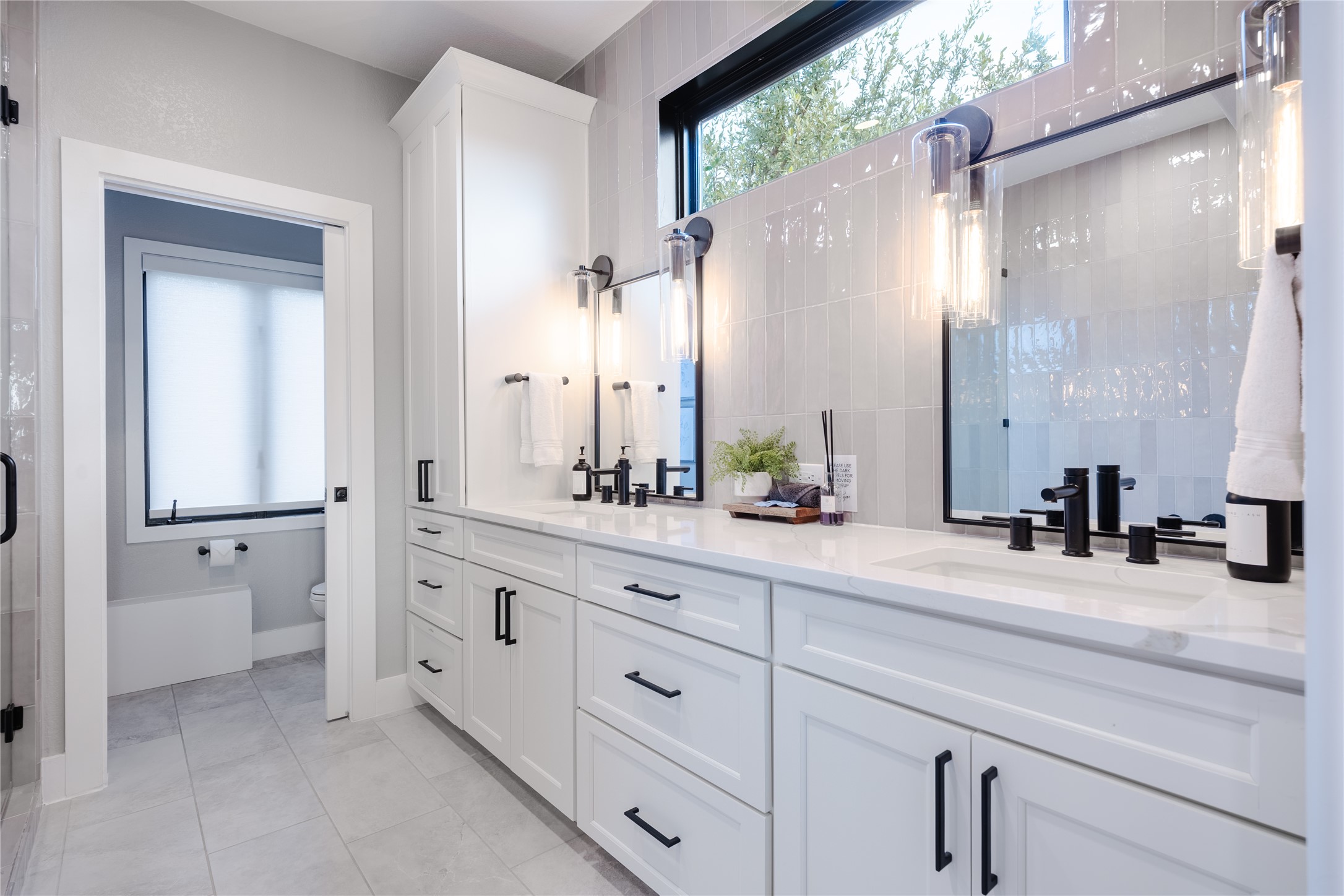 516 Deckhouse Drive Point Venture, TX 78645 - Photo 14 of 36 a bathroom with a double vanity sink mirror and shower