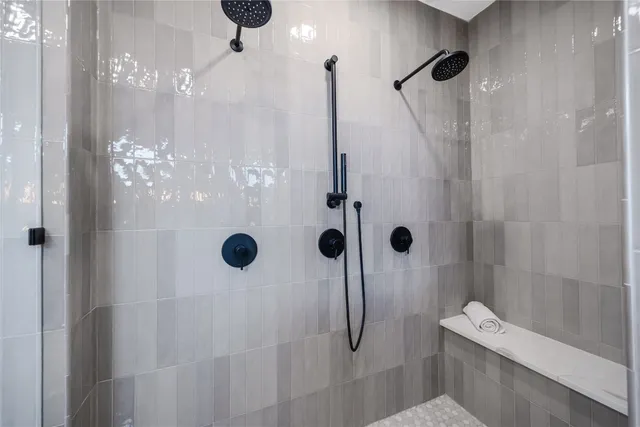a bathroom with a double vanity sink and a mirror