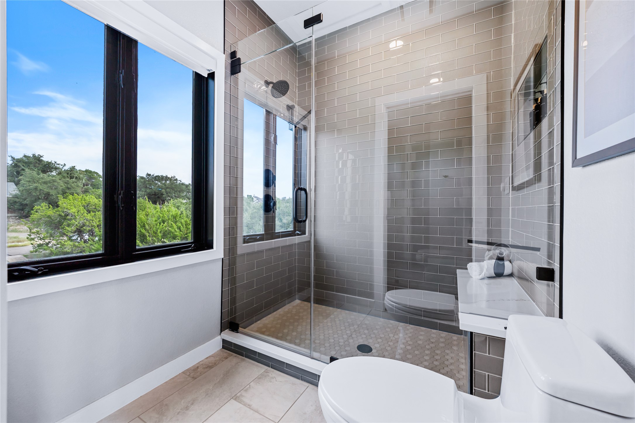 516 Deckhouse Drive Point Venture, TX 78645 - Photo 22 of 36 a bathroom with a sink toilet and shower