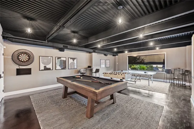 a view of swimming pool with outdoor seating and plants