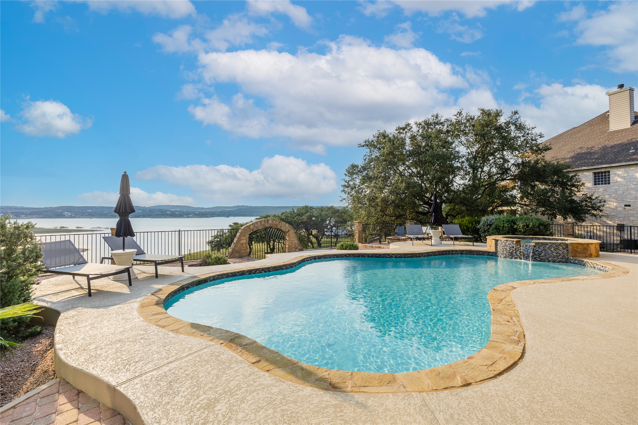 516 Deckhouse Drive Point Venture, TX 78645 - Photo 32 of 36 a view of a swimming pool with a yard