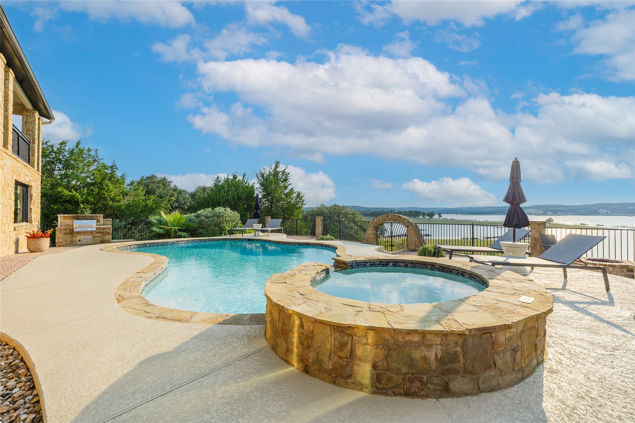 516 Deckhouse Drive Point Venture, TX 78645 - Photo 33 of 36 a view of a swimming pool with a lounge chair