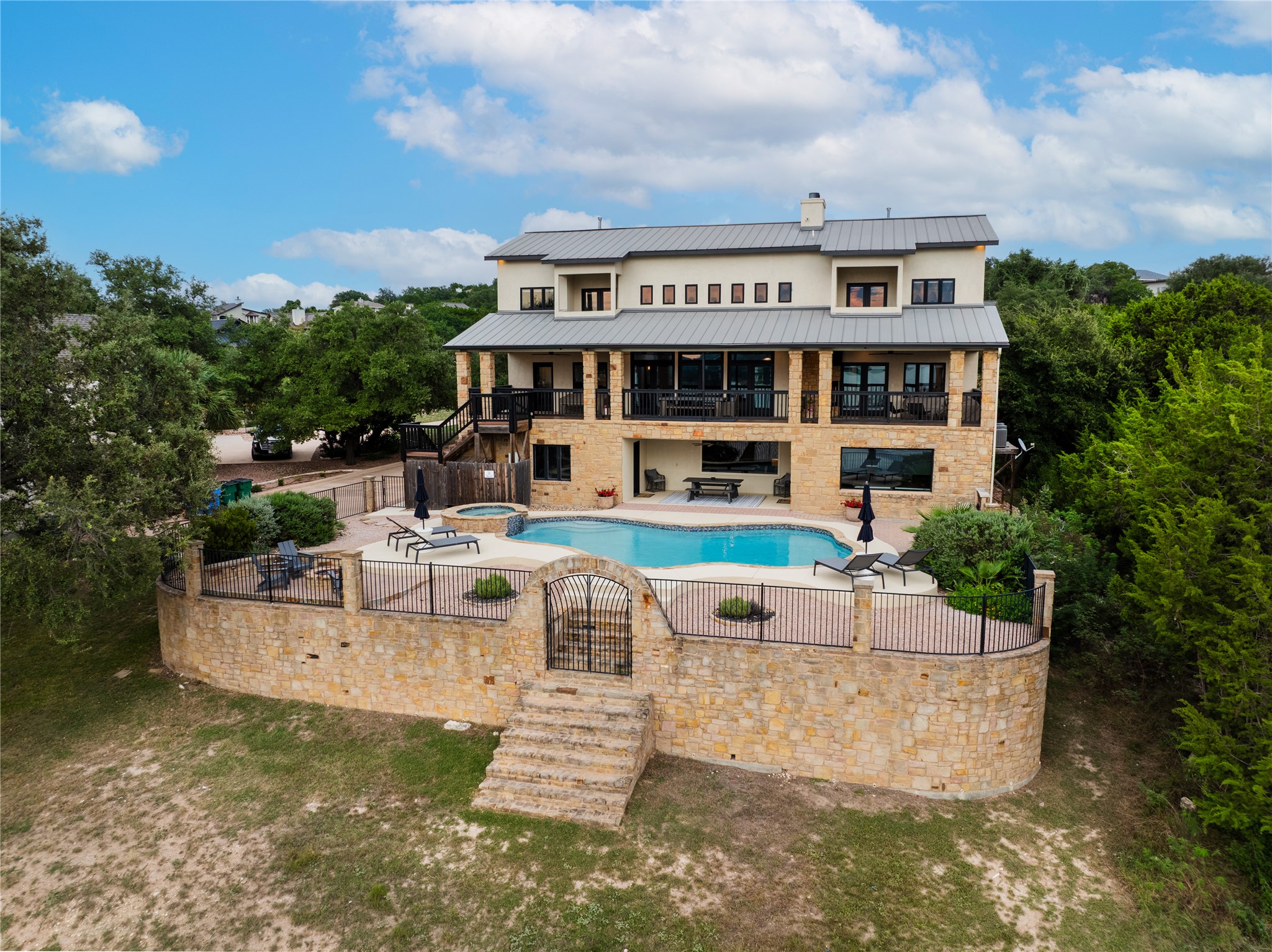 516 Deckhouse Drive Point Venture, TX 78645 - Photo 35 of 36 a view of house with swimming pool and sitting area