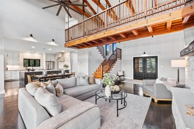 a living room with fireplace furniture and a flat screen tv