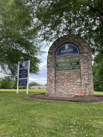 a view of field with trees in the background
