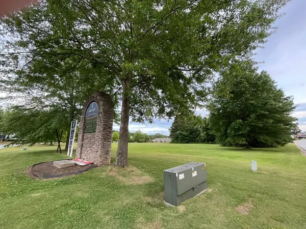 a view of a golf course with a lake