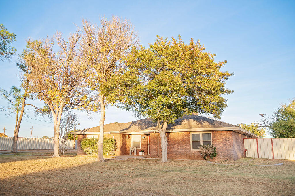 2917 Quail Ridge Road Denver City, TX 79323 - Photo 2 of 55 a front view of a house with a tree