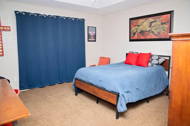 a bed room with a bed and a table