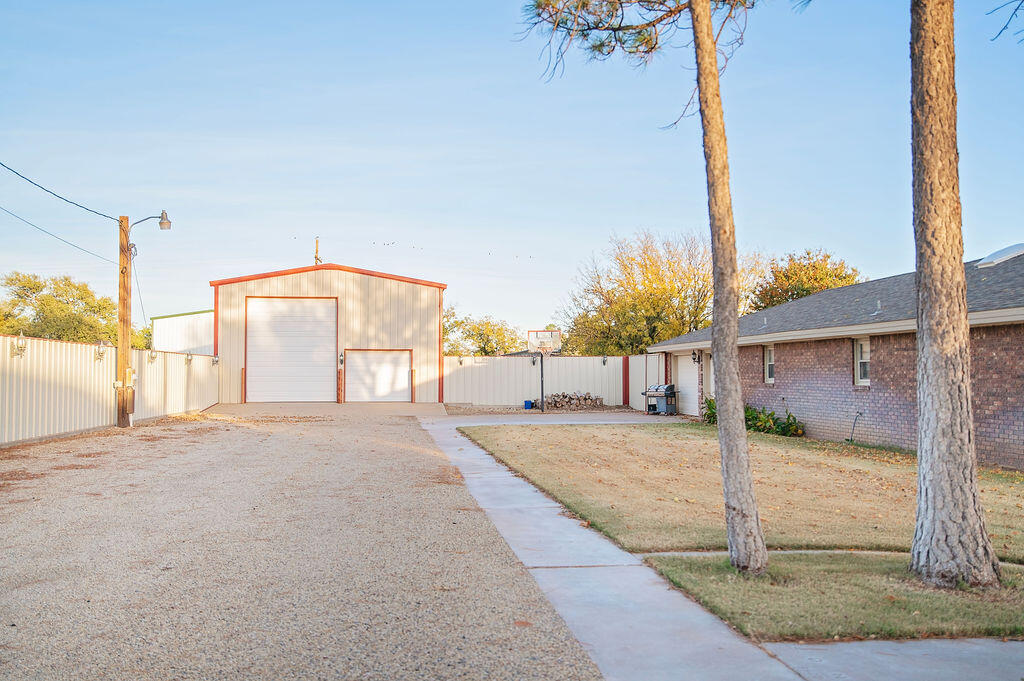 2917 Quail Ridge Road Denver City, TX 79323 - Photo 40 of 55 a view of a house with backyard and road