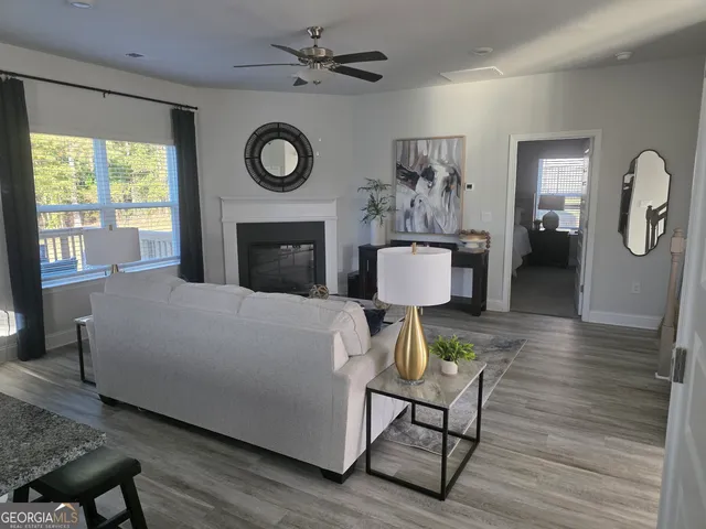 a living room with furniture and a fireplace