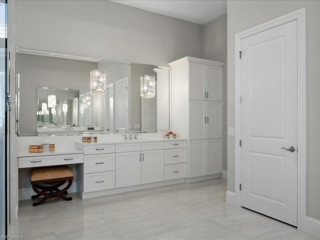18460 Blue Eye Loop Fort Myers, FL 33913 - Photo 18 of 50 a spacious bathroom with double vanity and a mirror