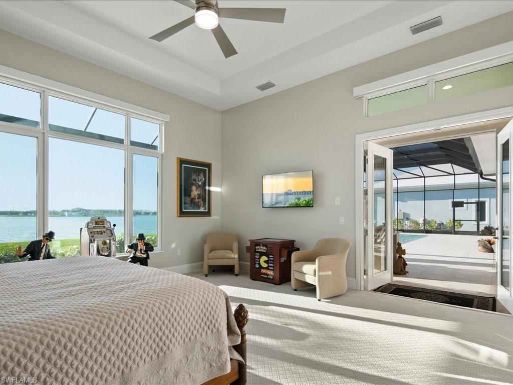 18460 Blue Eye Loop Fort Myers, FL 33913 - Photo 24 of 50 a bedroom with a bed and a large window