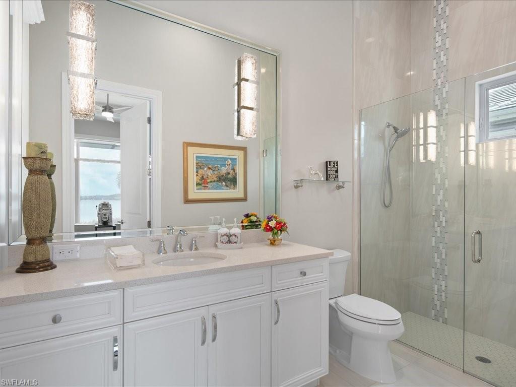 18460 Blue Eye Loop Fort Myers, FL 33913 - Photo 25 of 50 a bathroom with a sink toilet and shower