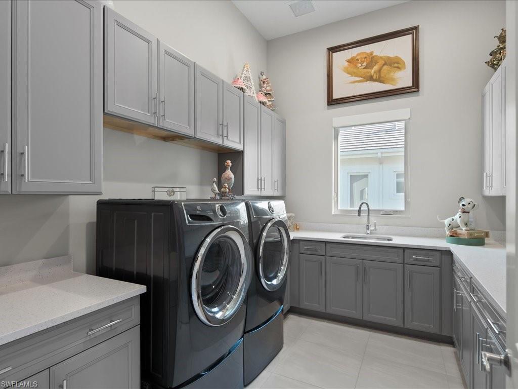 18460 Blue Eye Loop Fort Myers, FL 33913 - Photo 29 of 50 a utility room with sink dryer and washer