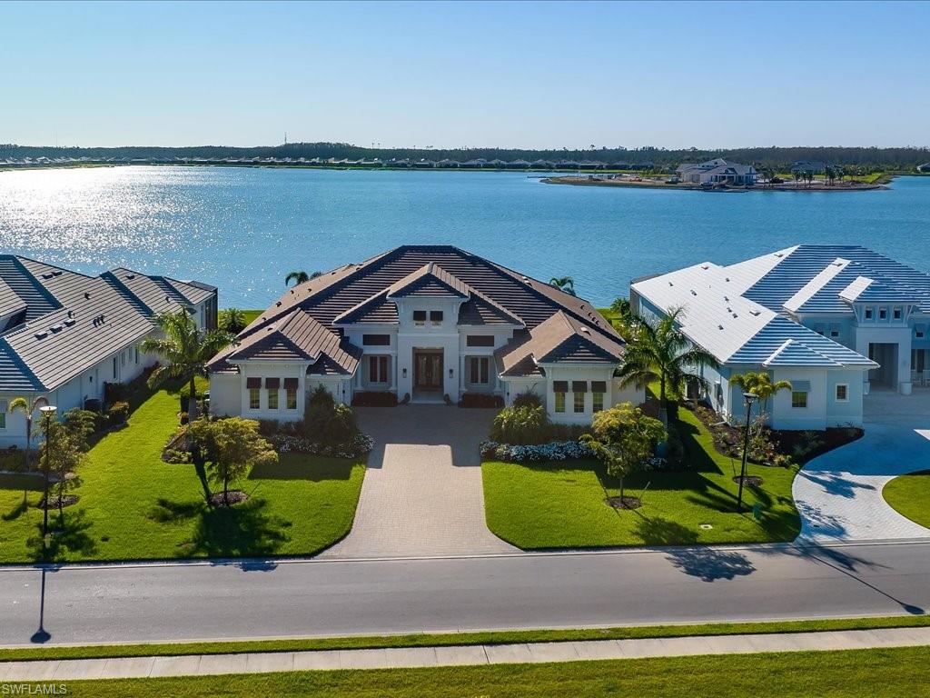 18460 Blue Eye Loop Fort Myers, FL 33913 - Photo 30 of 50 an aerial view of a house with a garden and lake view