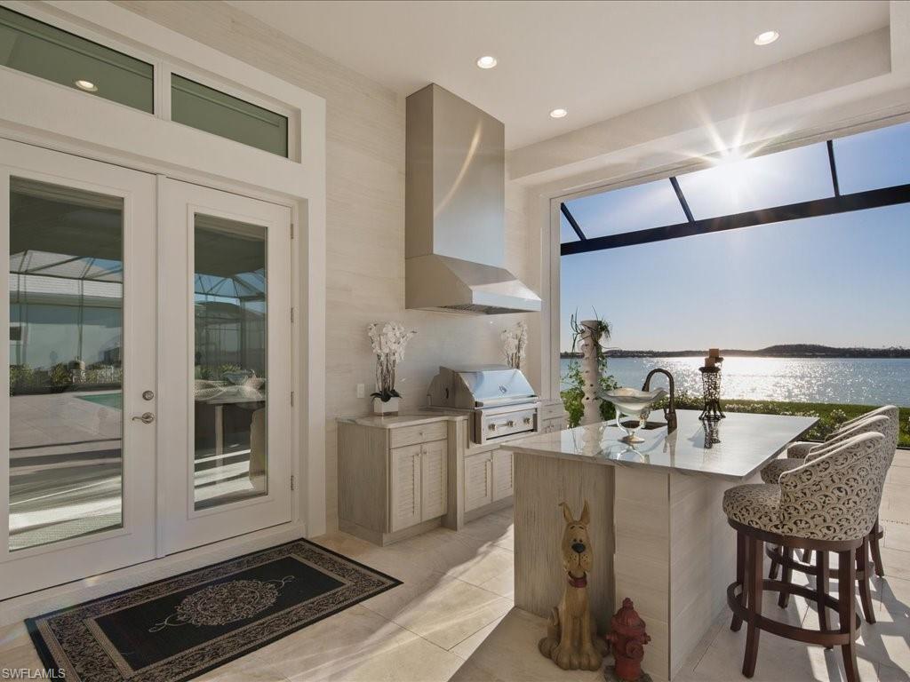 18460 Blue Eye Loop Fort Myers, FL 33913 - Photo 31 of 50 a kitchen with stainless steel appliances granite countertop a sink and a stove