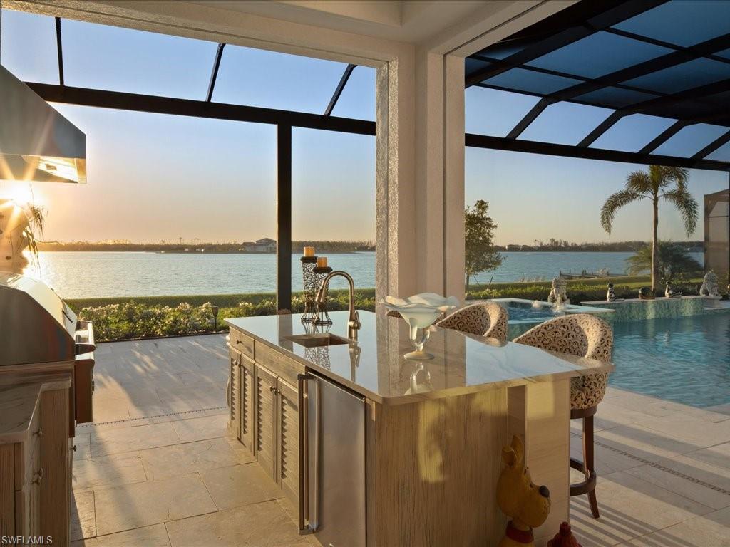 18460 Blue Eye Loop Fort Myers, FL 33913 - Photo 32 of 50 a dining room with furniture and a floor to ceiling window
