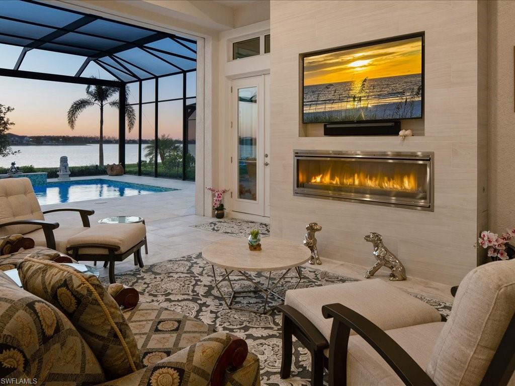 18460 Blue Eye Loop Fort Myers, FL 33913 - Photo 36 of 50 a living room with furniture and a flat screen tv