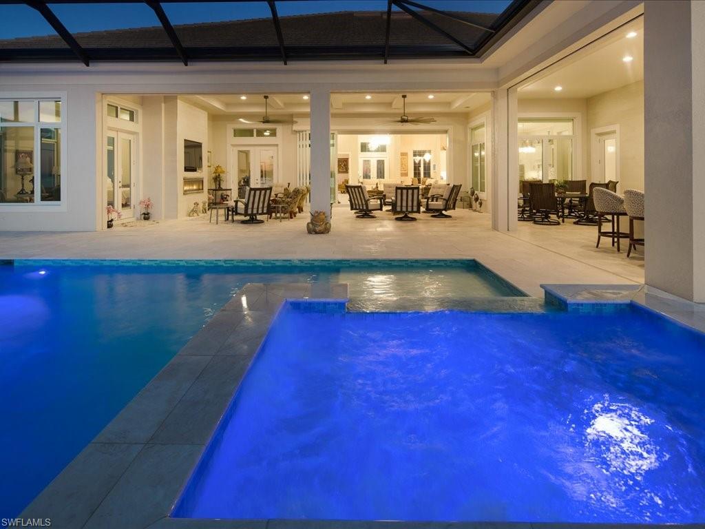 18460 Blue Eye Loop Fort Myers, FL 33913 - Photo 40 of 50 a view of swimming pool with a table and chairs