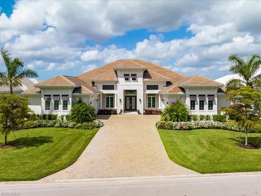 18460 Blue Eye Loop Fort Myers, FL 33913 - Photo 50 of 50 a front view of a house with a yard