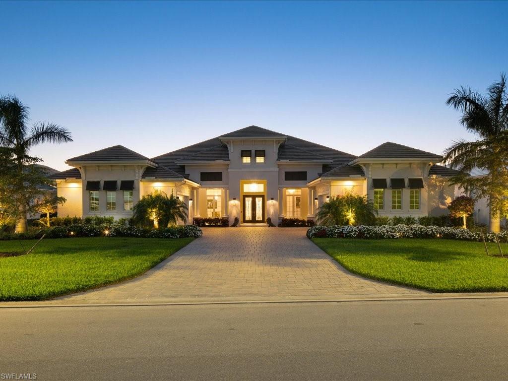 18460 Blue Eye Loop Fort Myers, FL 33913 - Photo 43 of 50 a front view of a house with a yard and porch