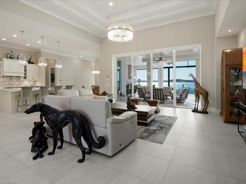 18460 Blue Eye Loop Fort Myers, FL 33913 - Photo 8 of 50 a living room with furniture and a flat screen tv