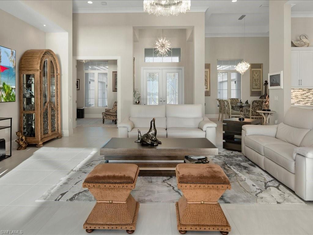 18460 Blue Eye Loop Fort Myers, FL 33913 - Photo 9 of 50 a living room with furniture and a large mirror