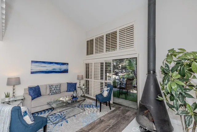 a kitchen with stainless steel appliances granite countertop a sink and a white cabinets
