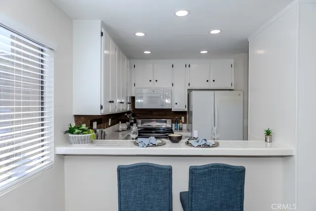 a view of a dining room with furniture and a table