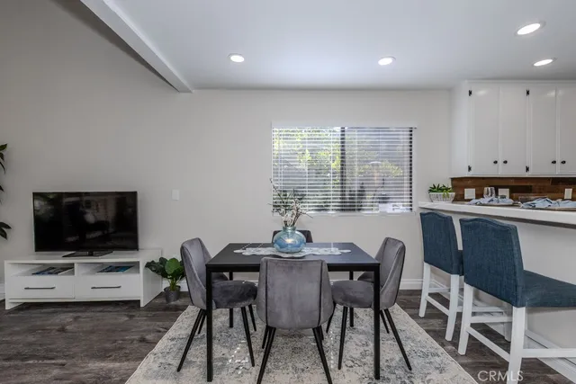 a kitchen with a table and chairs in it
