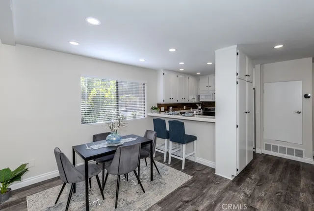 a kitchen with cabinets appliances and a sink