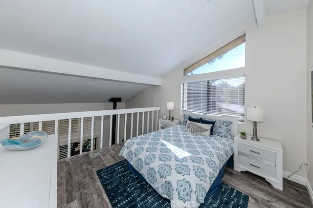 a bedroom with furniture and a window