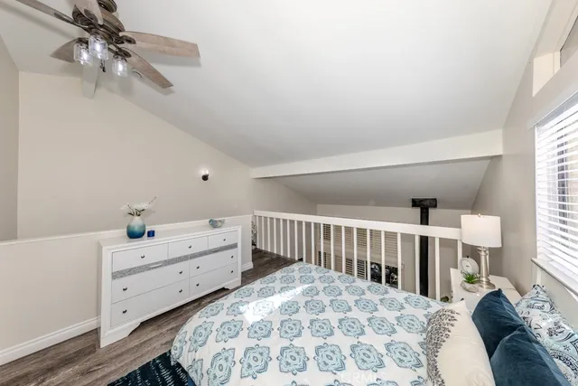 a bedroom with bed and a window