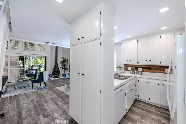 a view of entryway with wooden floor and windows