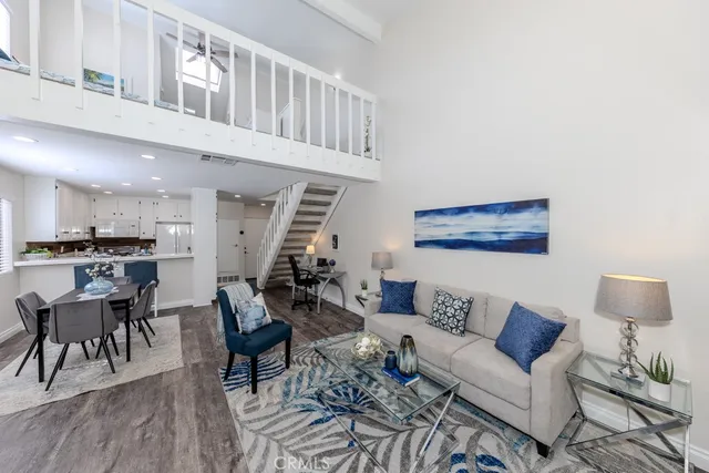 a living room with furniture or wooden floor and a potted plant