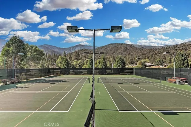 a bathroom with a sink mirror and vanity